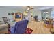Bright open floorplan with hardwood floors that connects the living room, kitchen, office, and dining areas at 301 Kings Blvd # 130, Sun City Center, FL 33573