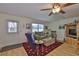 Cozy living room with hardwood floors, comfortable seating, and plenty of room for entertaining at 301 Kings Blvd # 130, Sun City Center, FL 33573
