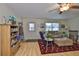 Cozy living room with lots of natural light, comfortable seating, and hardwood flooring at 301 Kings Blvd # 130, Sun City Center, FL 33573