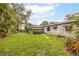 Spacious backyard with lush green grass and mature landscaping at 3107 S Emerson St, Tampa, FL 33629