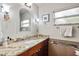Bathroom featuring granite countertop, modern fixtures, and a window at 3107 S Emerson St, Tampa, FL 33629