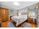 Bright main bedroom with hardwood floors, neutral walls, and natural light at 3107 S Emerson St, Tampa, FL 33629