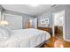 Bright bedroom with hardwood floors, closet, and access to an ensuite bathroom at 3107 S Emerson St, Tampa, FL 33629