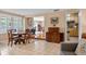 Bright dining room featuring a round table, shuttered windows, and an open layout at 3107 S Emerson St, Tampa, FL 33629