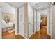 Hallway leading to a bedroom; wood floors add warmth and character to this interior space at 3107 S Emerson St, Tampa, FL 33629