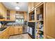 Traditional kitchen with open storage, modern appliances, and ample counter space at 3107 S Emerson St, Tampa, FL 33629