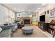 Cozy living room with stone fireplace, comfortable seating, and tiled floors at 3107 S Emerson St, Tampa, FL 33629