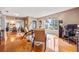 Open-concept living room with wood floors and natural light from windows at 3107 S Emerson St, Tampa, FL 33629