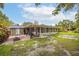 Enjoy the outdoors on this home's back patio with a view of the yard at 3107 S Emerson St, Tampa, FL 33629