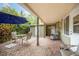 Covered patio with brick flooring and outdoor seating area at 3107 S Emerson St, Tampa, FL 33629