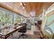 Bright sunroom featuring a wood ceiling, large windows, and ample natural light at 3107 S Emerson St, Tampa, FL 33629