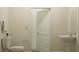 Clean and modern bathroom with a pedestal sink, toilet, and ample natural light at 32046 Griffin Sands Ln, San Antonio, FL 33576