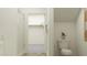 Bright bathroom featuring a shower and toilet, with access to a large walk-in closet at 32046 Griffin Sands Ln, San Antonio, FL 33576
