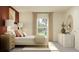 Bright bedroom with neutral tones, large window, and stylish decorative accents at 32046 Griffin Sands Ln, San Antonio, FL 33576
