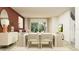 Open-concept dining area with modern decor and abundant natural light at 32046 Griffin Sands Ln, San Antonio, FL 33576