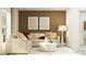 Cozy living room with modern decor, comfortable seating, and a relaxing atmosphere at 32046 Griffin Sands Ln, San Antonio, FL 33576