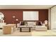 Cozy living room with stylish decor, comfortable seating, and a warm ambiance at 32046 Griffin Sands Ln, San Antonio, FL 33576