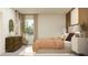 Relaxing main bedroom featuring large window views, and stylish decor at 32046 Griffin Sands Ln, San Antonio, FL 33576