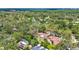 Aerial view of the property showcasing its location amidst lush trees and nearby amenities at 327 Sunnyside Rd, Temple Terrace, FL 33617