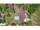 Aerial view showcasing the house roof and layout, surrounded by mature trees and greenery at 327 Sunnyside Rd, Temple Terrace, FL 33617