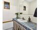 Retro bathroom features tiled sink and countertop with a framed mirror above the space at 327 Sunnyside Rd, Temple Terrace, FL 33617