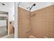 Inviting bathroom features a shower with tiled walls and updated fixtures, and easy access at 327 Sunnyside Rd, Temple Terrace, FL 33617