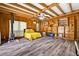 Bedroom featuring a wood burning stove, built in shelves and wood-look flooring at 327 Sunnyside Rd, Temple Terrace, FL 33617