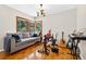 Inviting Den featuring parquet flooring, a window seat, and ample space for creative expression at 327 Sunnyside Rd, Temple Terrace, FL 33617
