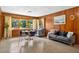 Inviting dining area with hardwood flooring, a round table, and bright natural light at 327 Sunnyside Rd, Temple Terrace, FL 33617
