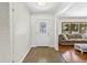 Bright foyer with a decorative glass front door, leading into a spacious living area at 327 Sunnyside Rd, Temple Terrace, FL 33617