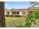 Lovely single-story home with a brick facade and well-maintained lawn at 327 Sunnyside Rd, Temple Terrace, FL 33617