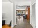Hallway view showing the transition between rooms with views of dining and living spaces at 327 Sunnyside Rd, Temple Terrace, FL 33617