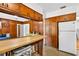 Spacious eat-in kitchen boasts wood cabinets, breakfast bar, and plenty of counter space at 327 Sunnyside Rd, Temple Terrace, FL 33617