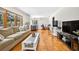 Bright and airy living room with hardwood floors and large windows overlooking the landscape at 327 Sunnyside Rd, Temple Terrace, FL 33617
