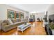 Spacious living room with hardwood floors, comfortable seating, and natural light at 327 Sunnyside Rd, Temple Terrace, FL 33617