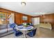 Open-concept living and dining area with blue furniture and lots of natural light at 327 Sunnyside Rd, Temple Terrace, FL 33617