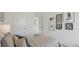 This is a bedroom with clean white walls, baseball-themed decor and light gray carpeting at 33042 Osprey Peak Way, San Antonio, FL 33576