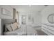 Comfortable bedroom featuring plush bedding, neutral tones, and stylish decor for a relaxing retreat at 33042 Osprey Peak Way, San Antonio, FL 33576