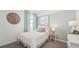 Serene bedroom with soft blue walls, white bedding, and stylish decor for a comfortable space at 33050 Osprey Peak Way, San Antonio, FL 33576