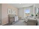 Bright Bedroom with a crib, rocking chair, and views of the backyard at 33072 Osprey Peak Way, San Antonio, FL 33576
