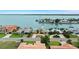 Panoramic aerial view of a waterfront neighborhood showcasing luxurious homes and boat docks at 333 Midway Is, Clearwater Beach, FL 33767