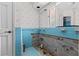 Retro bathroom with blue tiles with open plumbing at 333 Midway Is, Clearwater Beach, FL 33767