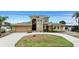 Stunning multi-story home features a manicured lawn and attached two-car garage at 333 Midway Is, Clearwater Beach, FL 33767