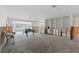 Large living room with many windows offering a view of the waterfront at 333 Midway Is, Clearwater Beach, FL 33767
