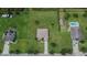 Stunning aerial view of a home showcasing a large yard, outbuilding, and private pool at 3411 Knoxville Pl, Plant City, FL 33566