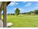 This home includes an expansive backyard with a large tree at 3411 Knoxville Pl, Plant City, FL 33566