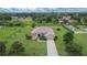 Beautiful home with a well-manicured lawn, mature trees, and landscaping providing great curb appeal at 3411 Knoxville Pl, Plant City, FL 33566
