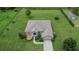 Attractive home with a large lot, mature trees, and fountain, set within a well-maintained neighborhood at 3411 Knoxville Pl, Plant City, FL 33566