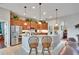 Inviting kitchen with granite countertops, stainless steel appliances, and breakfast bar seating at 3411 Knoxville Pl, Plant City, FL 33566