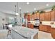 Stylish kitchen with granite countertops, stainless steel appliances, and a breakfast bar at 3411 Knoxville Pl, Plant City, FL 33566